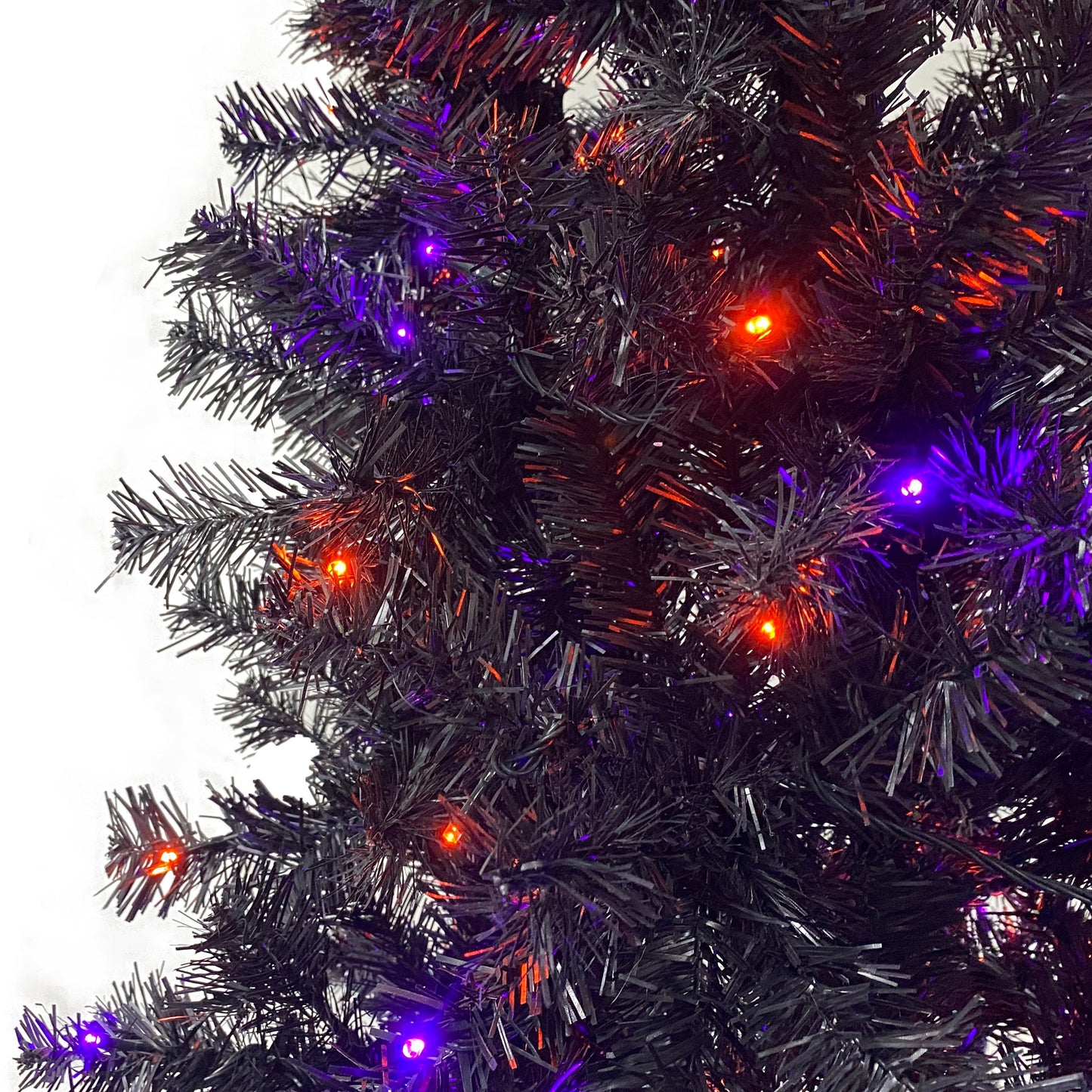 6FT artificial fir curved top Halloween tree, with 1080 lush branch tips and 300 LED lights in a Christmas and Halloween style